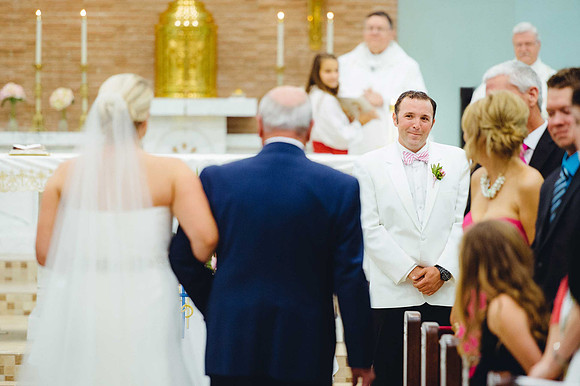 groom-watching-bride-walk-down-aisle